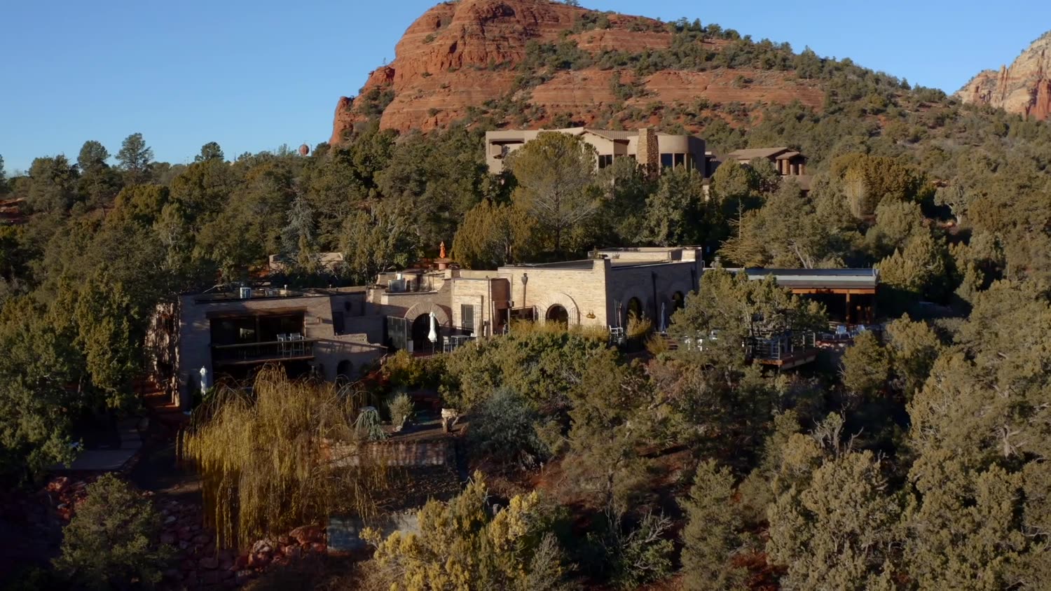 Custom residence beneath Bell Rock at golden hour